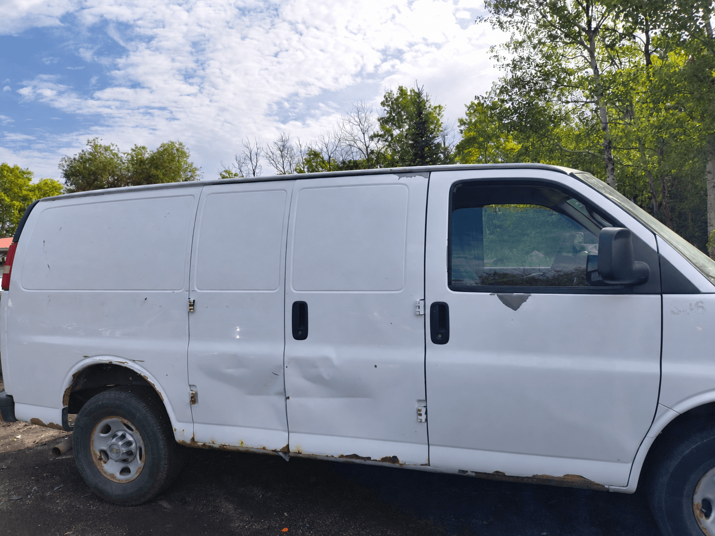 Real rusty Manitoba cargo van with identifying lettering removed