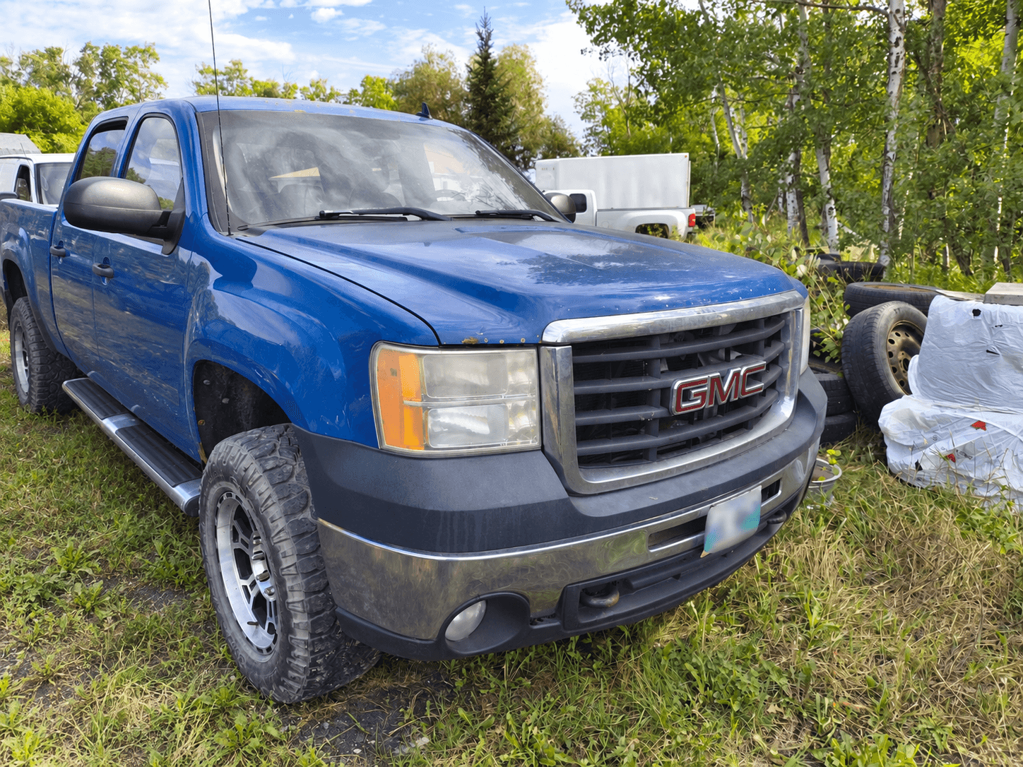 Real older Manitoba work truck with identifying details obscured